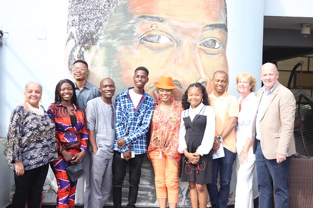 An image of the 5 winning poets, Fela's children, the Irish Ambassador's wife with a painting of the late Fela in the background at the Kalakuta Museum 