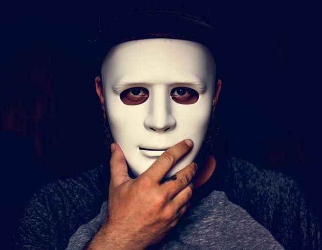 A man behind a mask