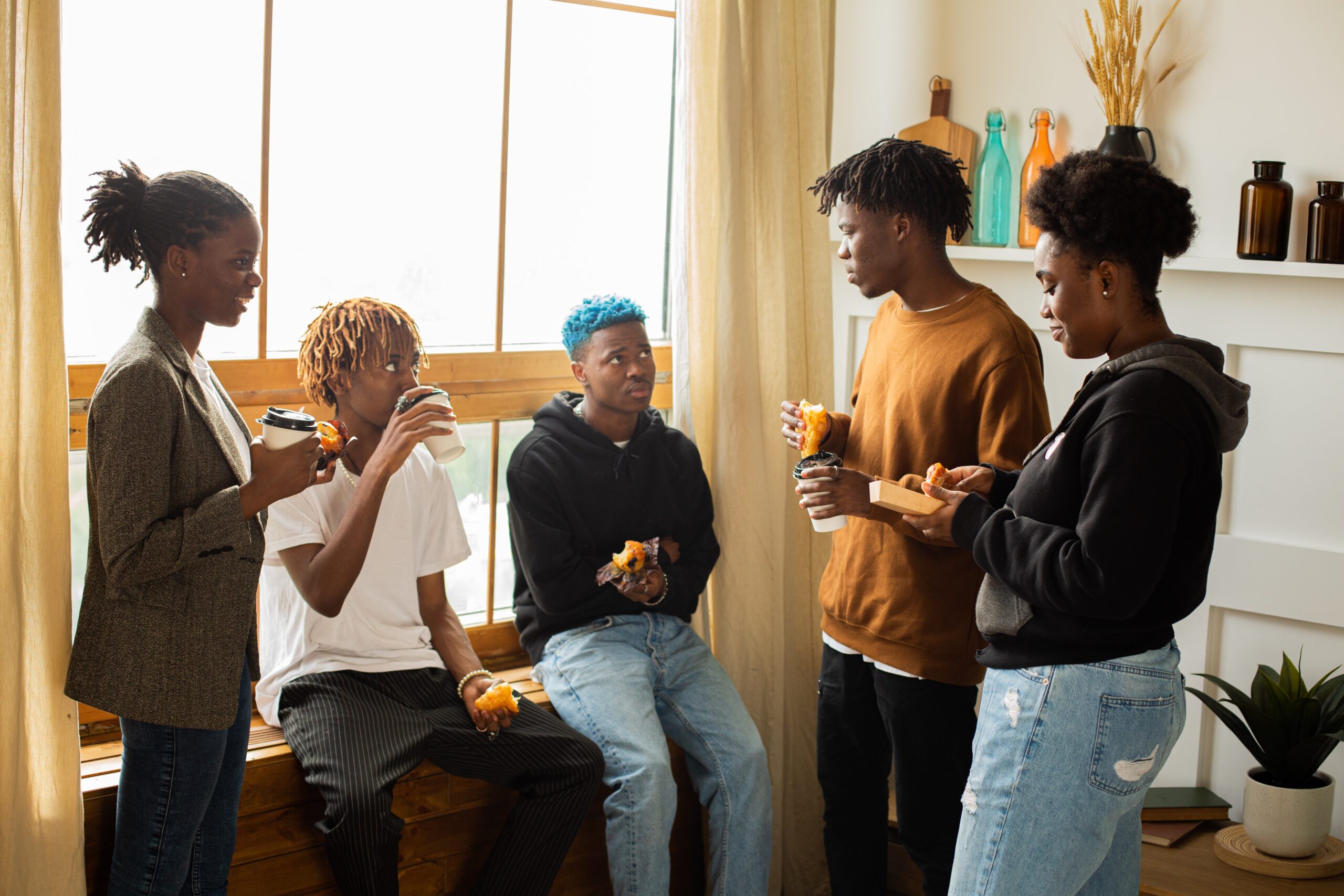 young black people gathered in a conversation
