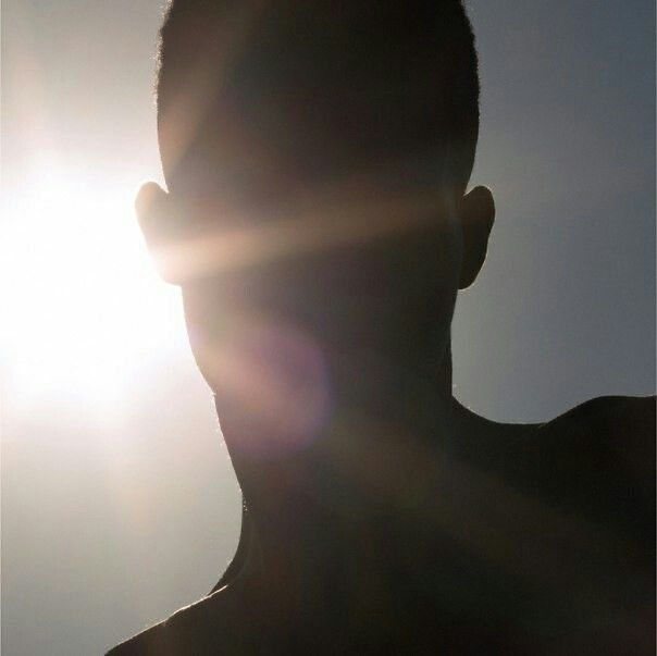 sun reflecting the a man