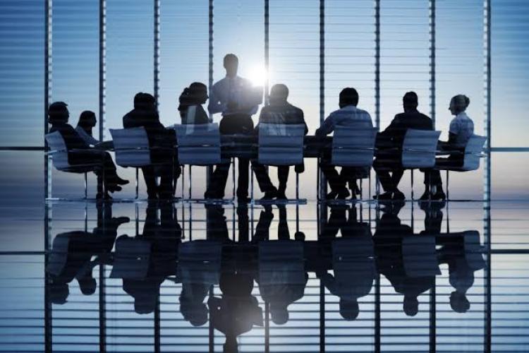 workers sitting at a meeting