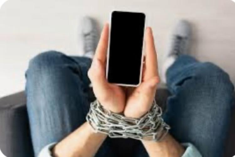 hands chained holding a phone