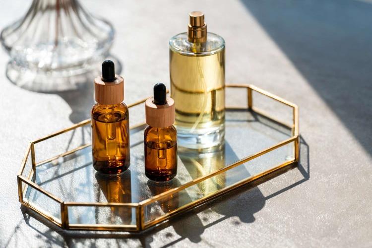 3 small sized  bottled scents arranged on the table