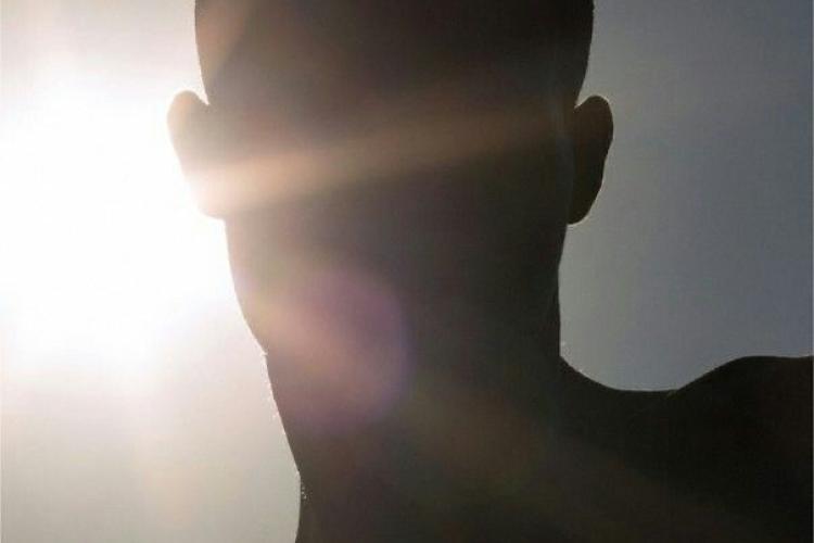 sun reflecting the a man