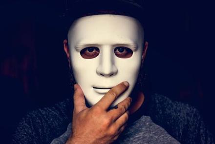 A man behind a mask