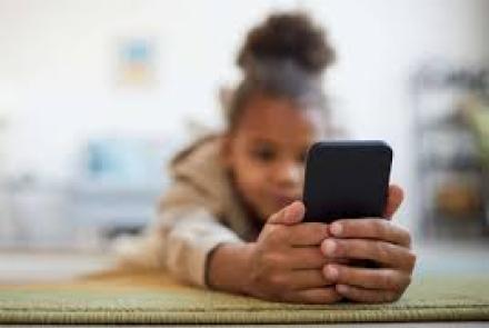 a girl holding a smartphone