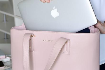 woman removing her mac book from her pink bag