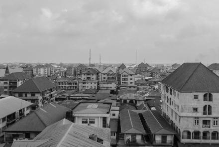 a black and white background  image of houses