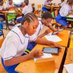 Secondary schools writing exams in a classroom